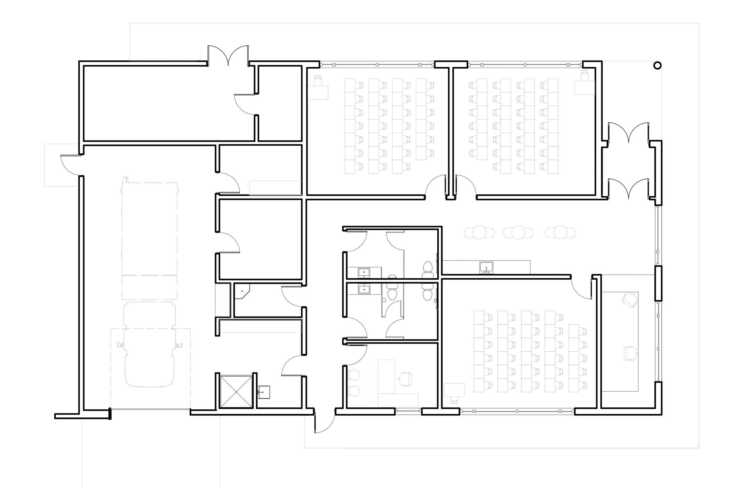 Floor plan showing the vehicle bay and gear room alongside the learning centre's classrooms.